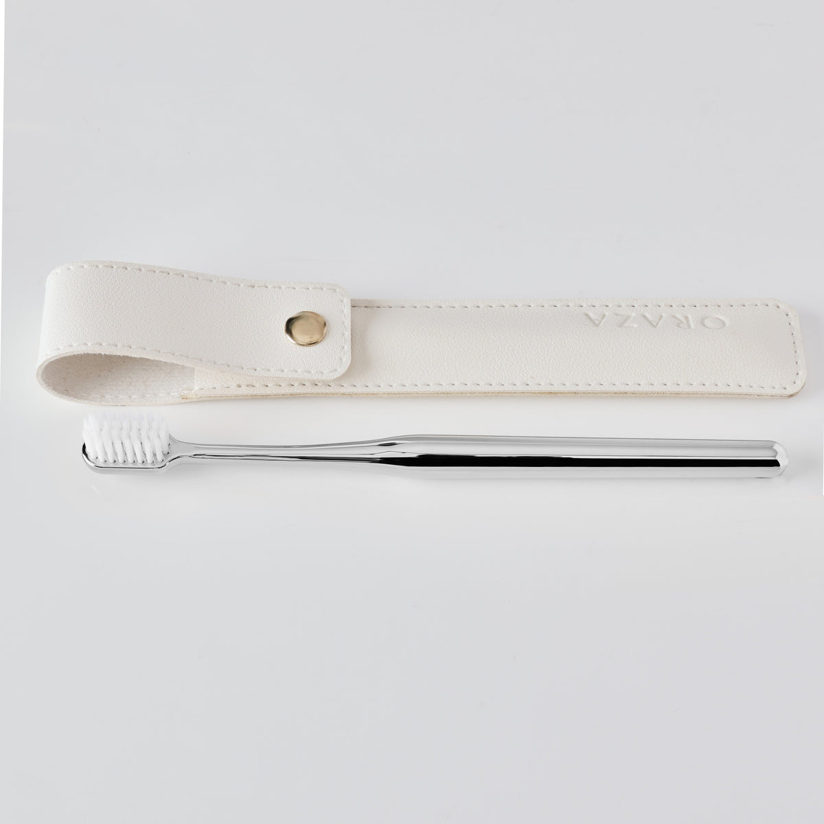WHITE LEATHER CASE & SILVER TOOTHBRUSH