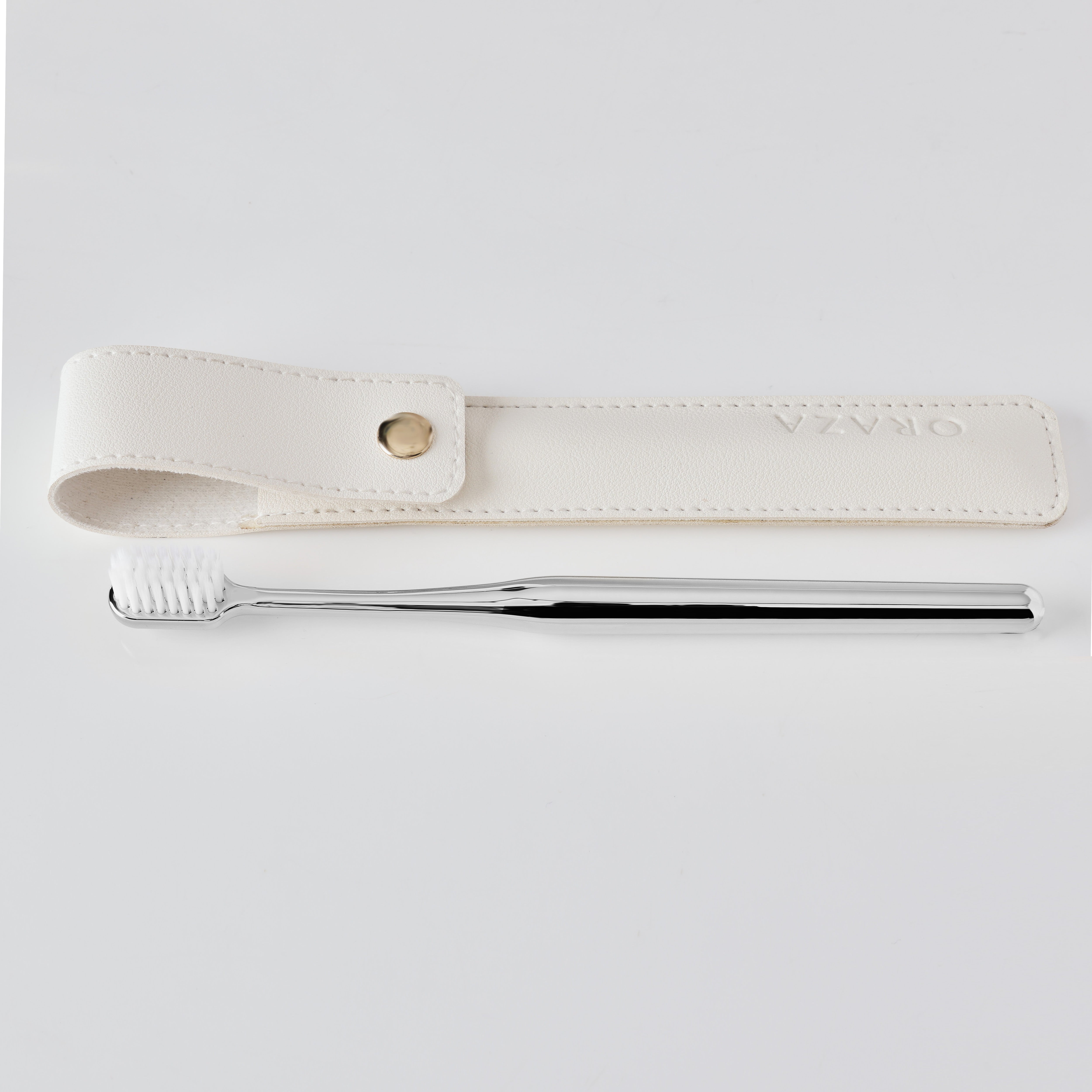 WHITE LEATHER CASE & SILVER TOOTHBRUSH