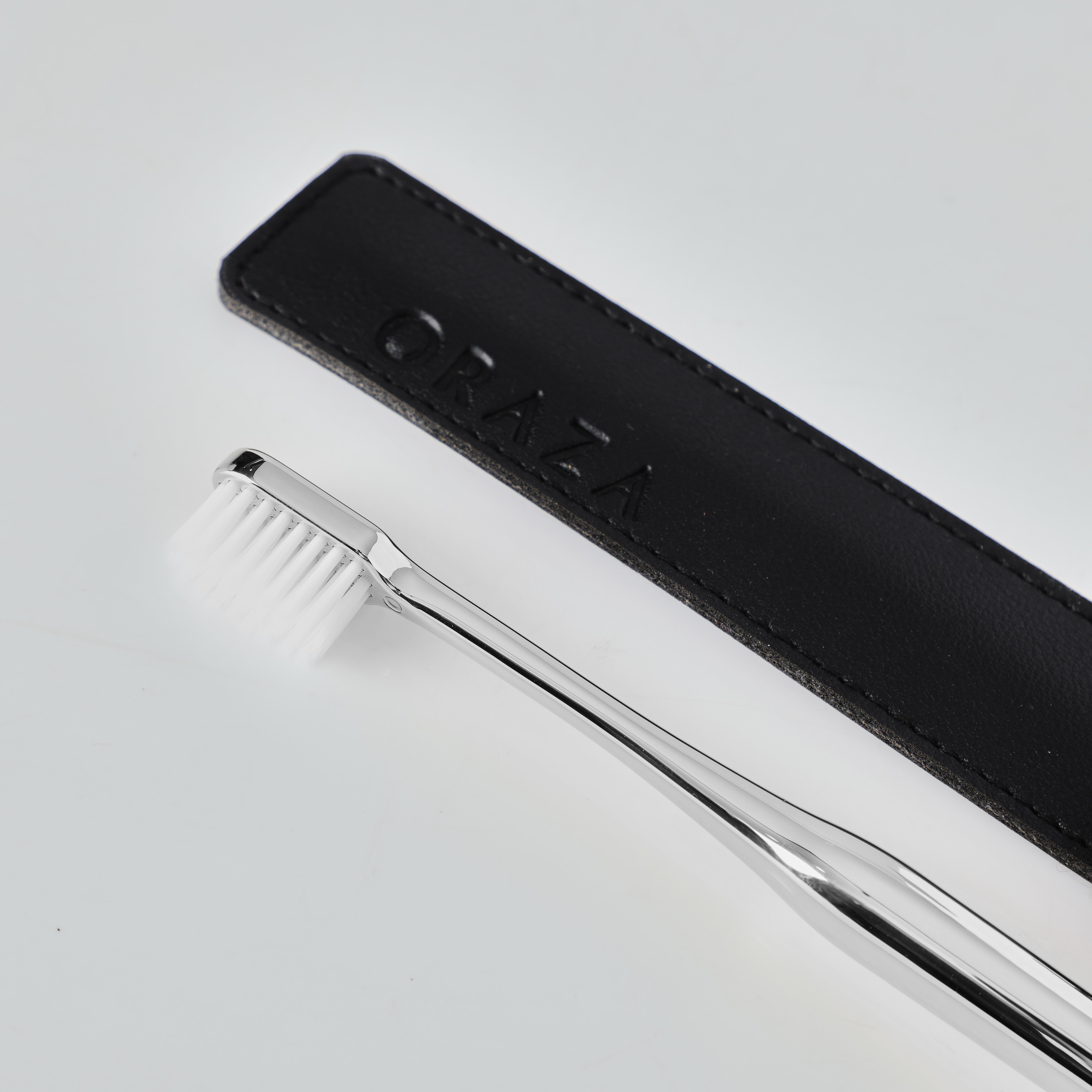 BLACK LEATHER CASE & SILVER TOOTHBRUSH