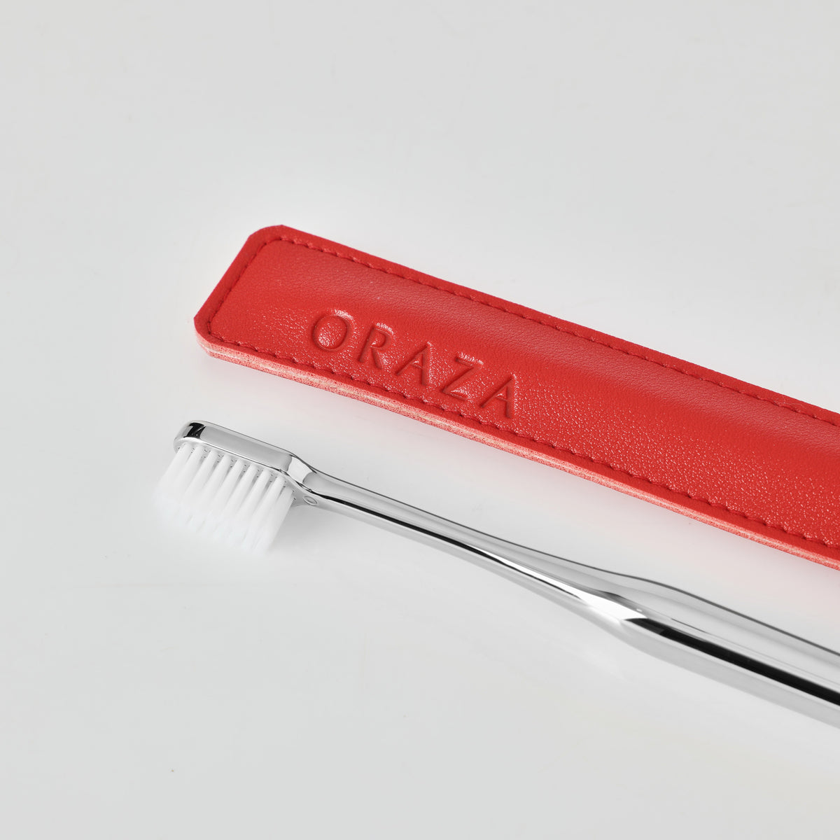 RED LEATHER CASE & SILVER TOOTHBRUSH