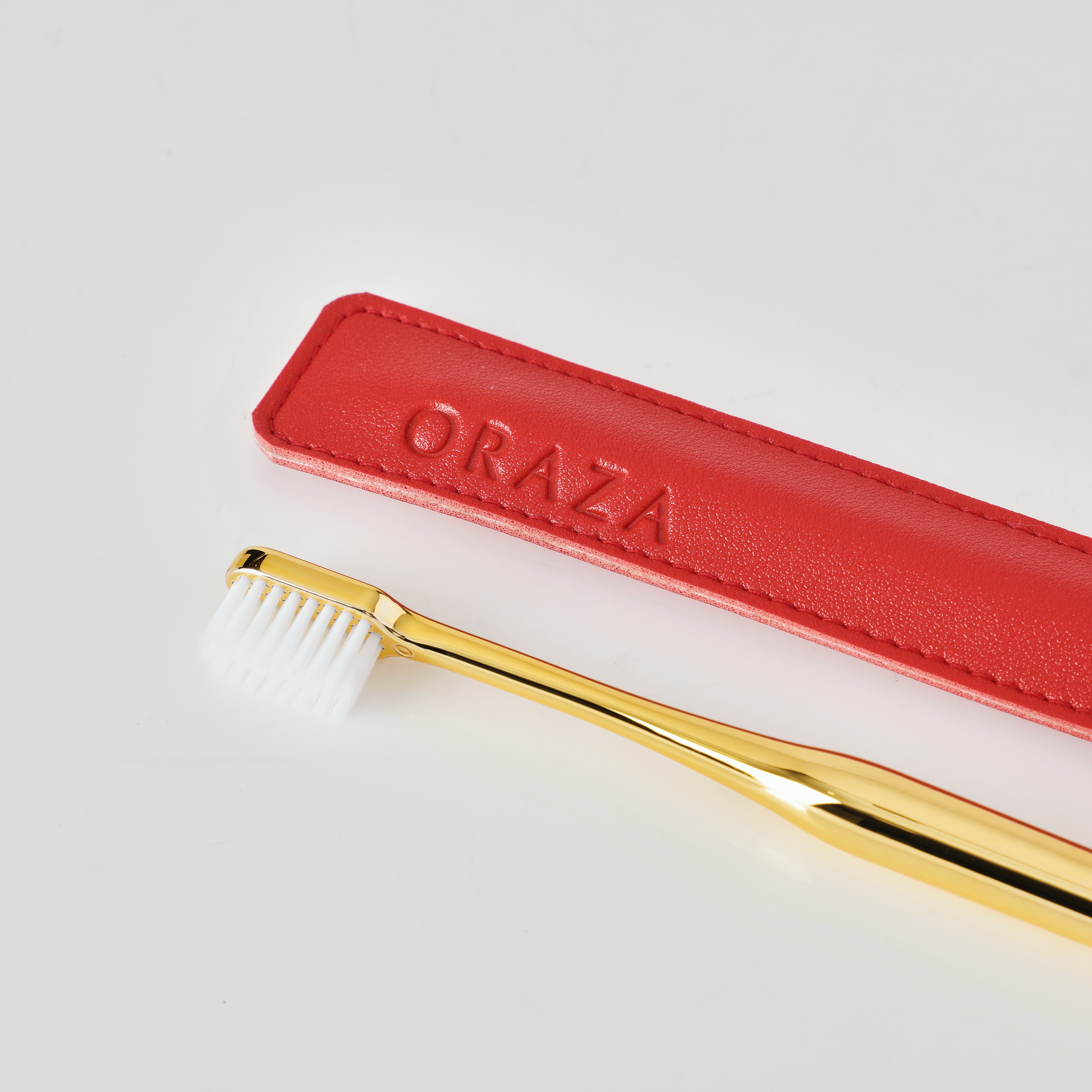 RED LEATHER CASE &  GOLD TOOTHBRUSH