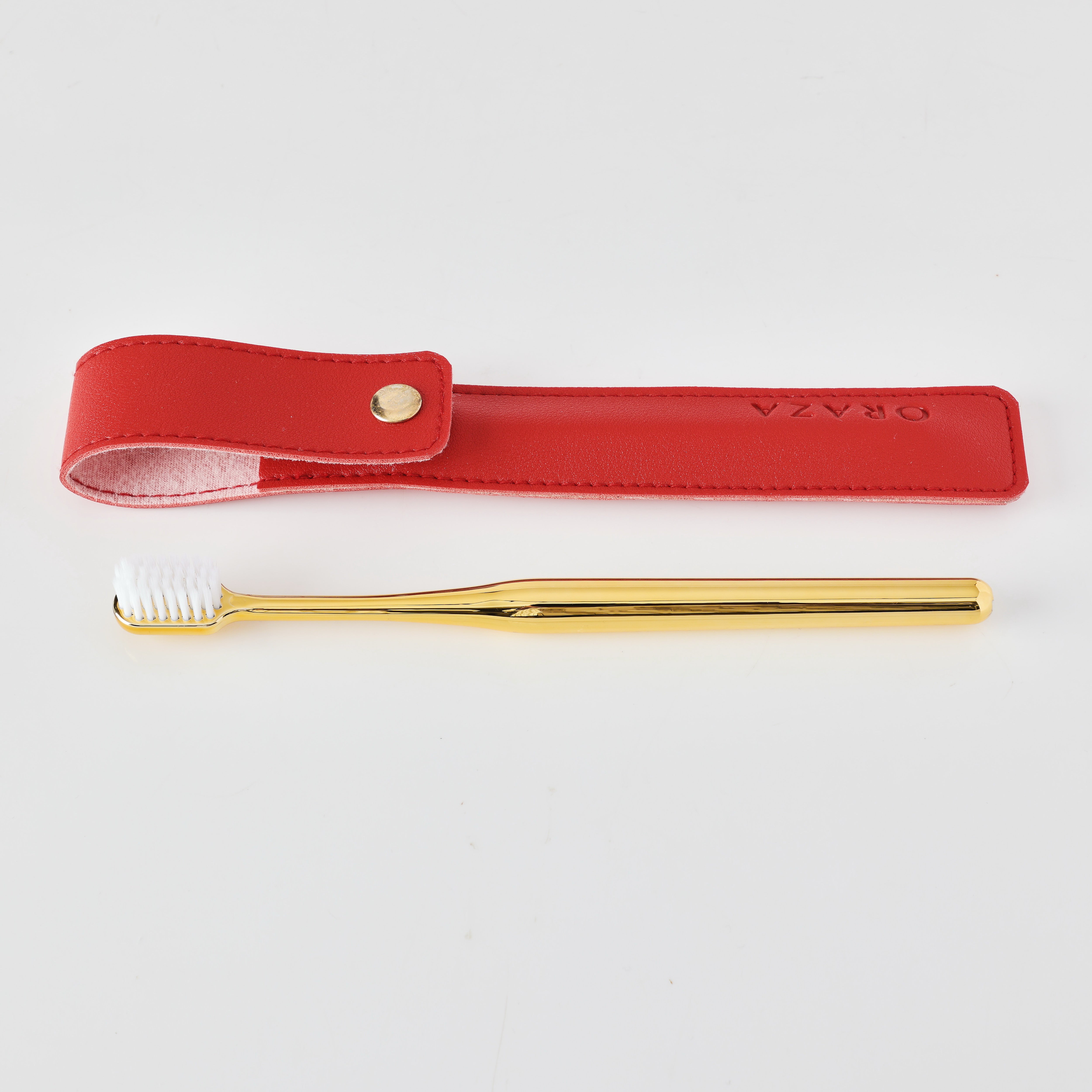 RED LEATHER CASE &  GOLD TOOTHBRUSH
