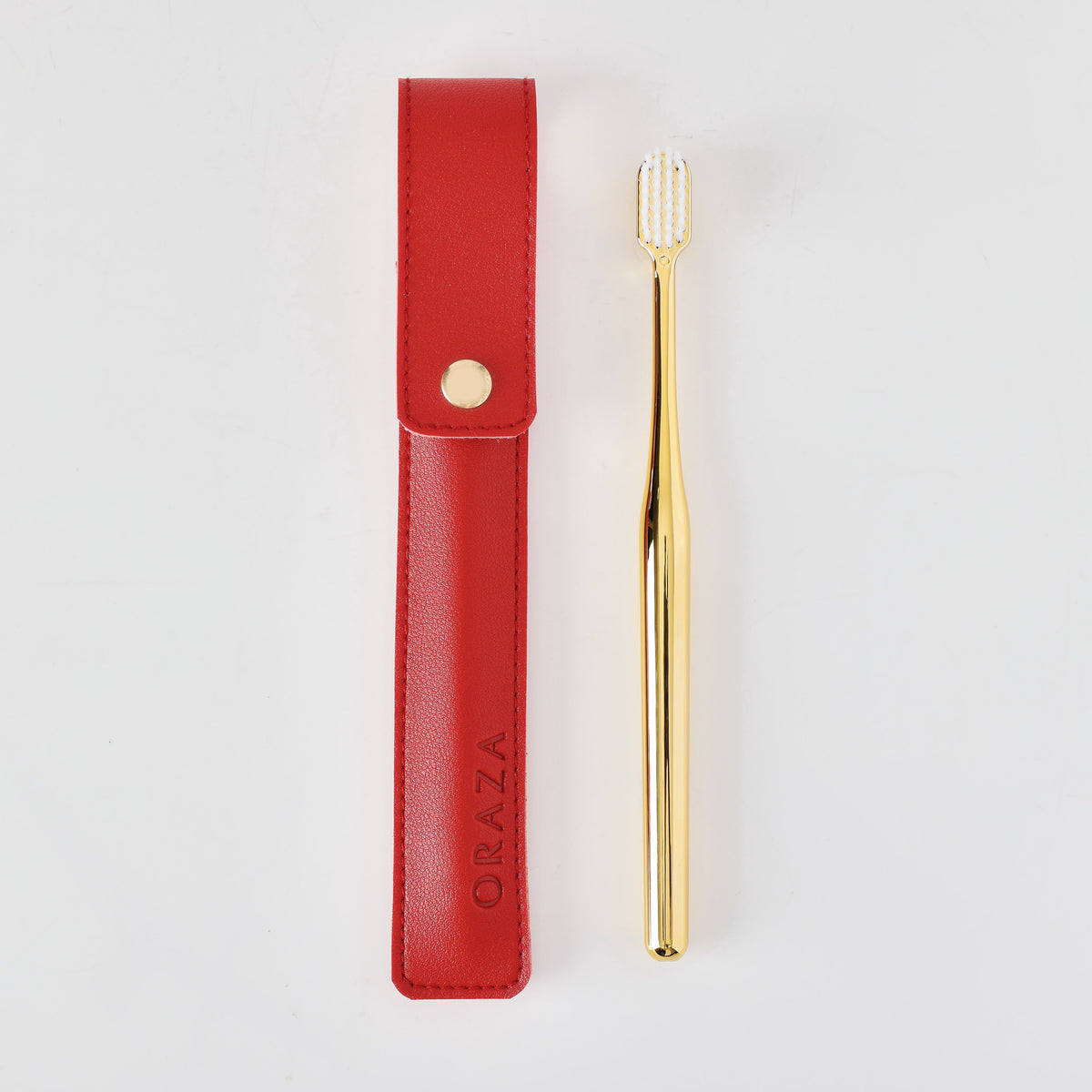 RED LEATHER CASE &  GOLD TOOTHBRUSH