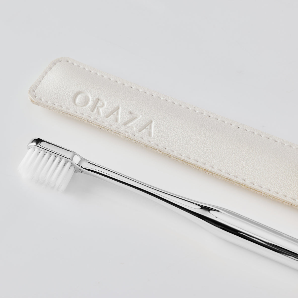 WHITE LEATHER CASE & SILVER TOOTHBRUSH