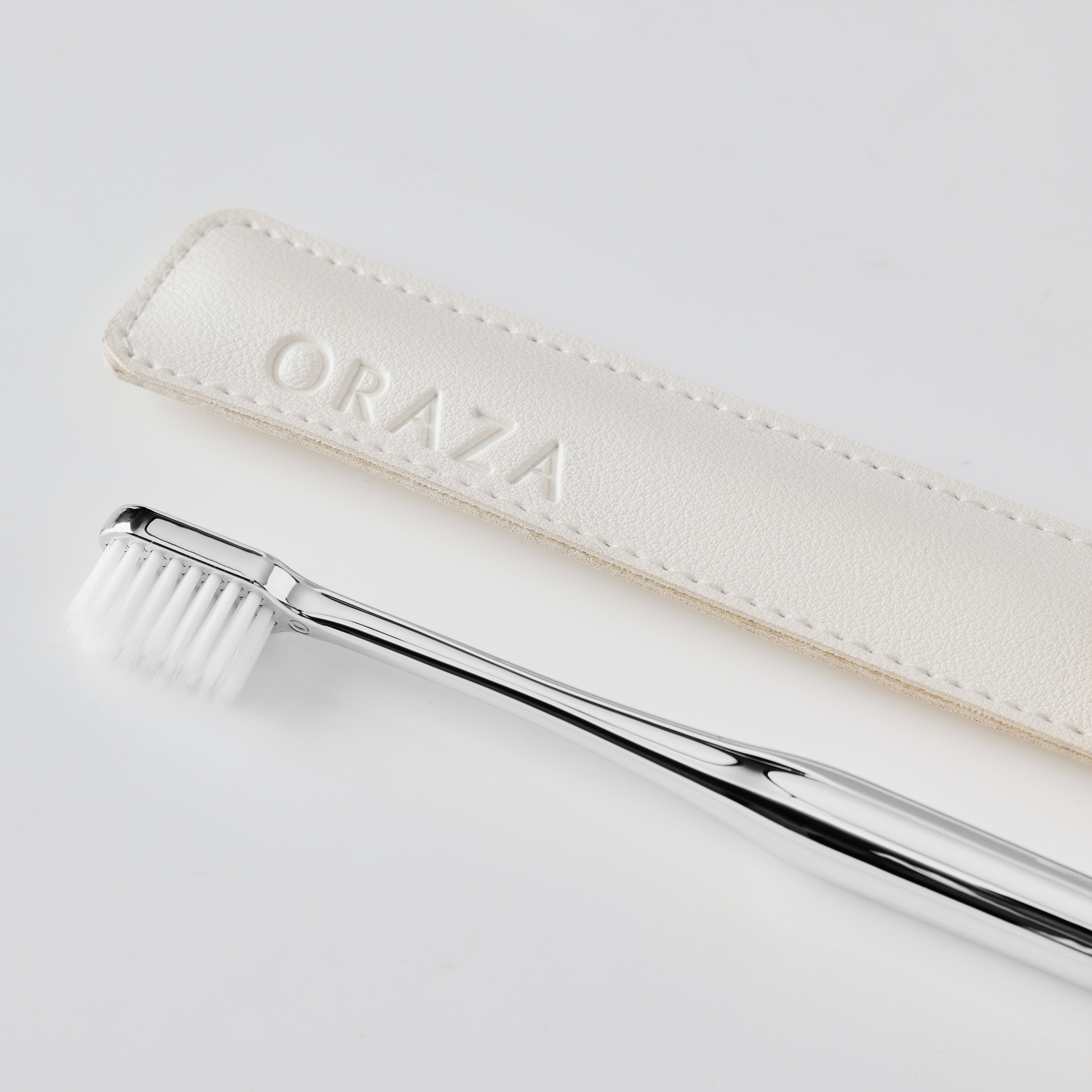 WHITE LEATHER CASE & SILVER TOOTHBRUSH