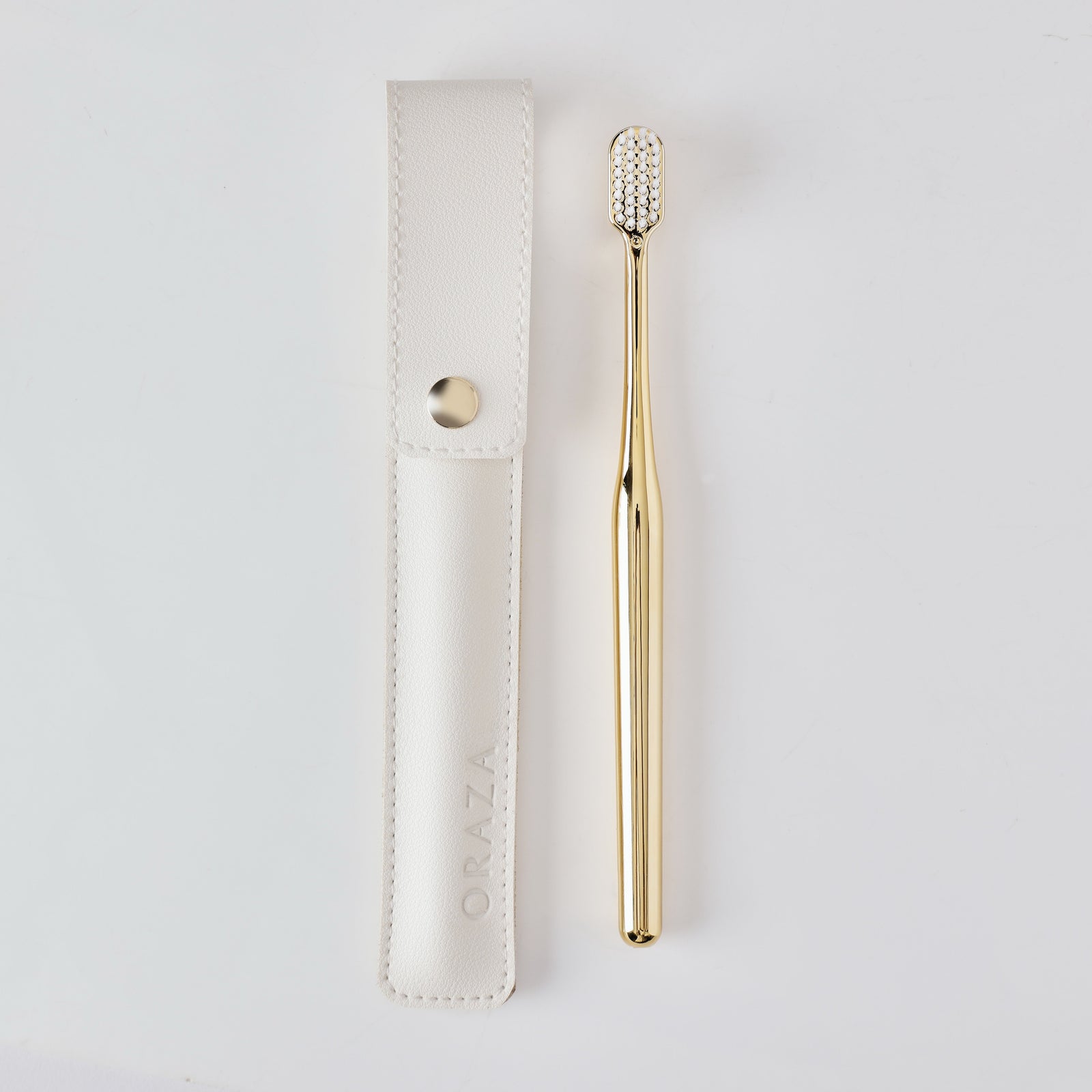 WHITE LEATHER CASE &  GOLD TOOTHBRUSH