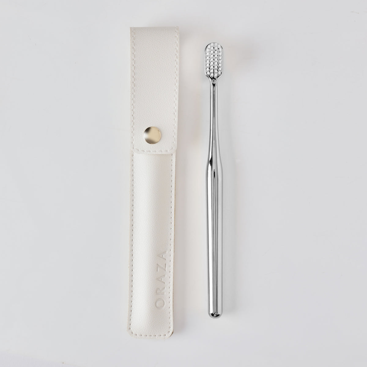 WHITE LEATHER CASE & SILVER TOOTHBRUSH