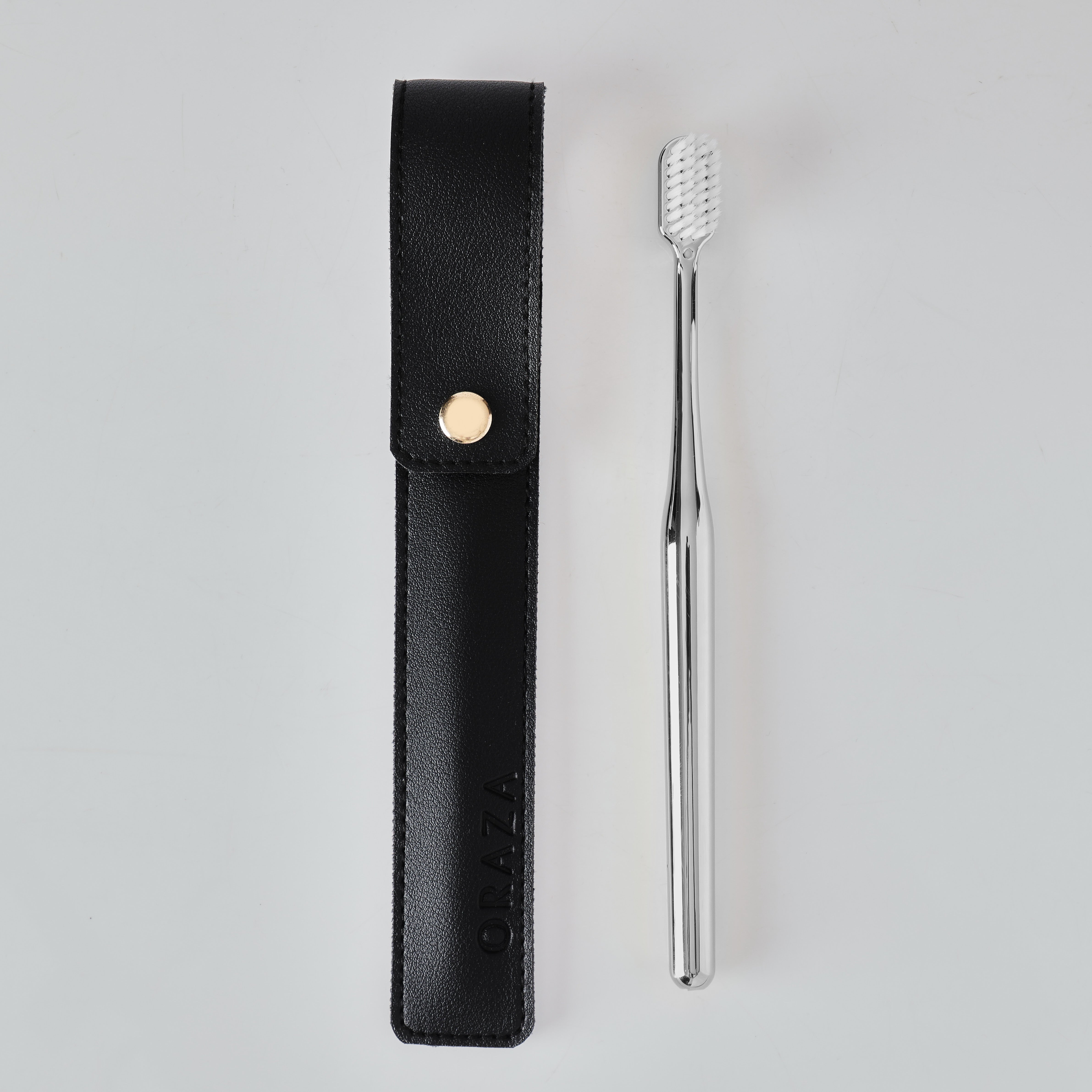 BLACK LEATHER CASE & SILVER TOOTHBRUSH